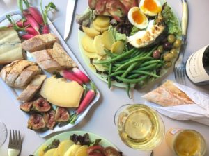 Salade niçoise with baguette, cheese plate, and wine on Bastille Day