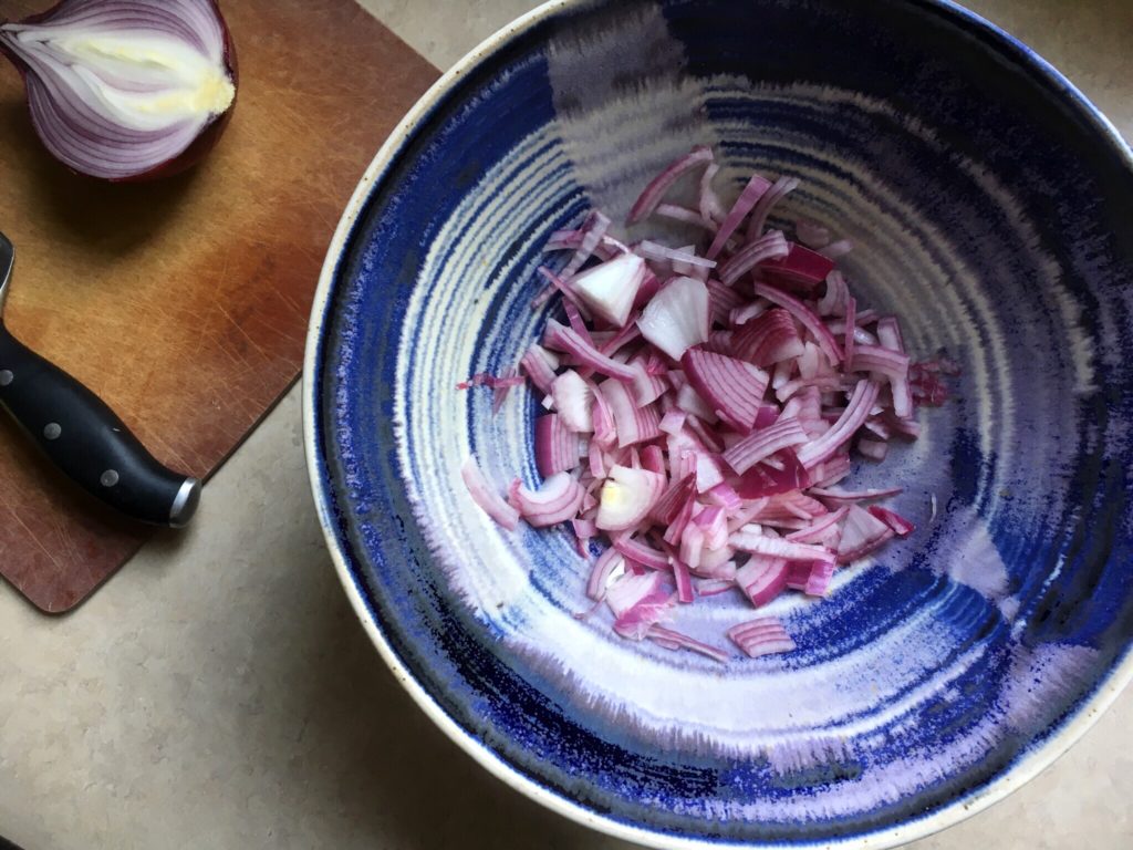 red onion and vinegar in blue bowl from provence