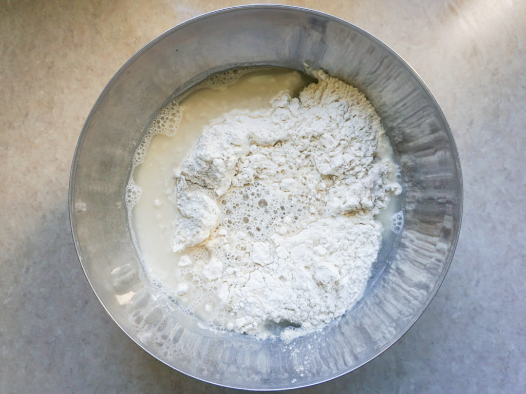 Ingredients for homemade one-step pizza dough in bowl