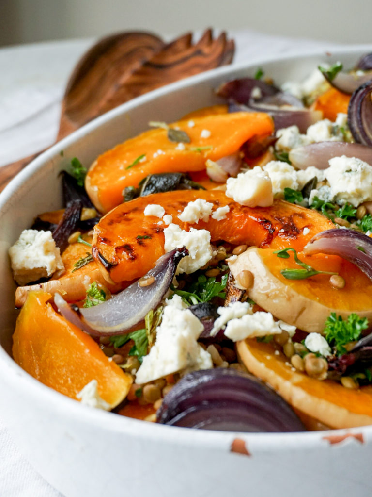 Roasted Butternut Squash with Lentils, Herbs, and Gorgonzola from Ottolenghi's Simple in white serving dish