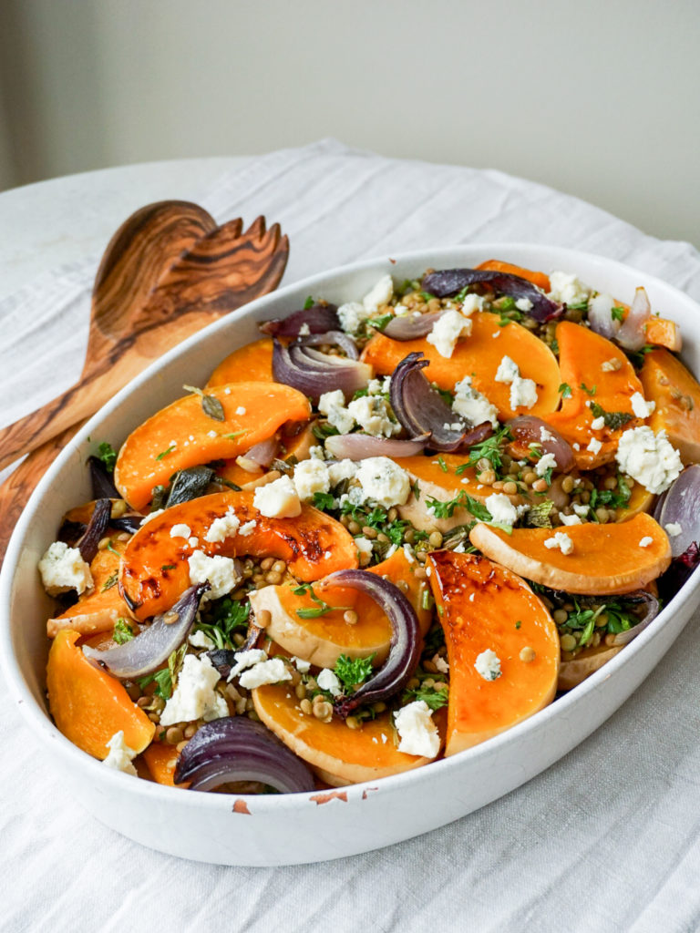 Roasted Butternut Squash with Lentils, Herbs, and Gorgonzola from Ottolenghi's Simple in white serving dish