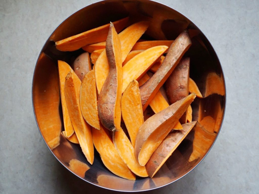 Yam wedges in bowl for Yam and Wild Rice Salad with Lime-Chili Vinaigrette recipe