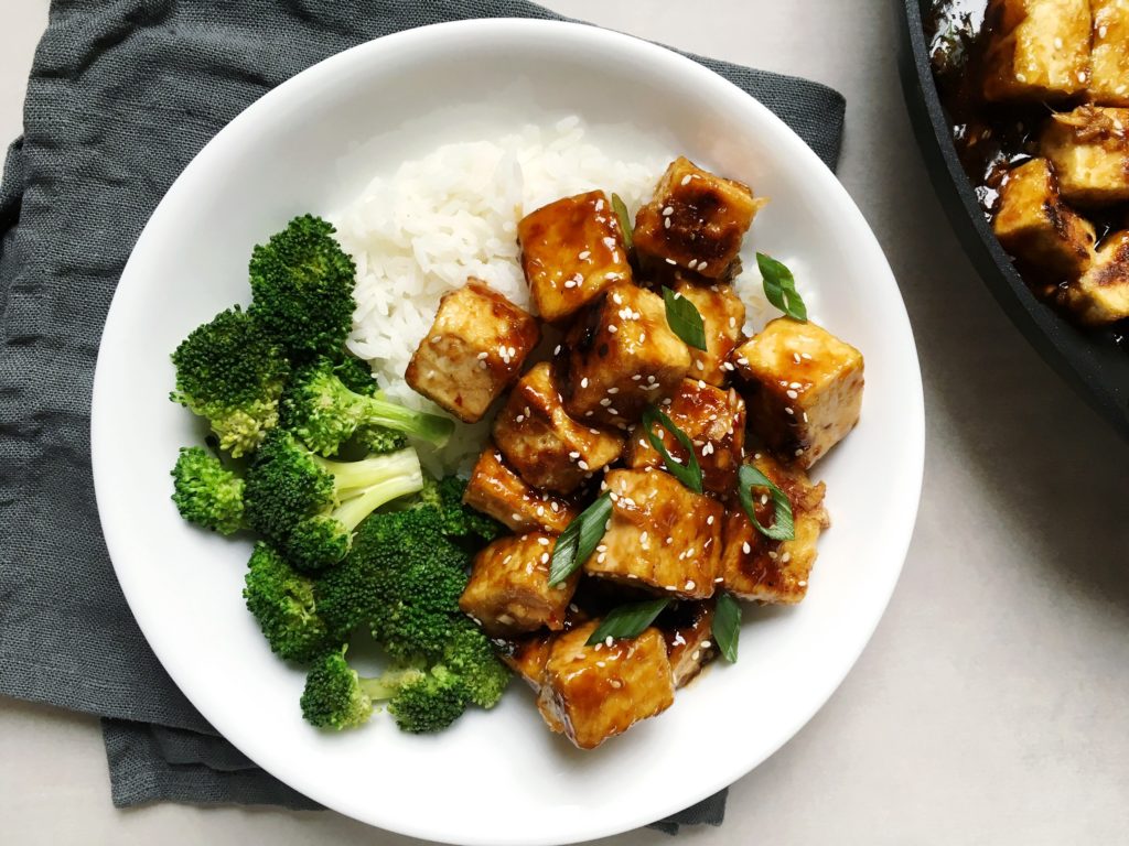 Takeout-Style Crispy Tofu with broccoli and white rice in white plate