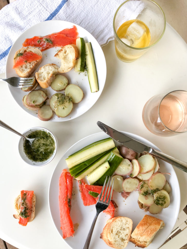 Spring dinner of gravlax salmon with dill-mustard dressing and homemade pickles