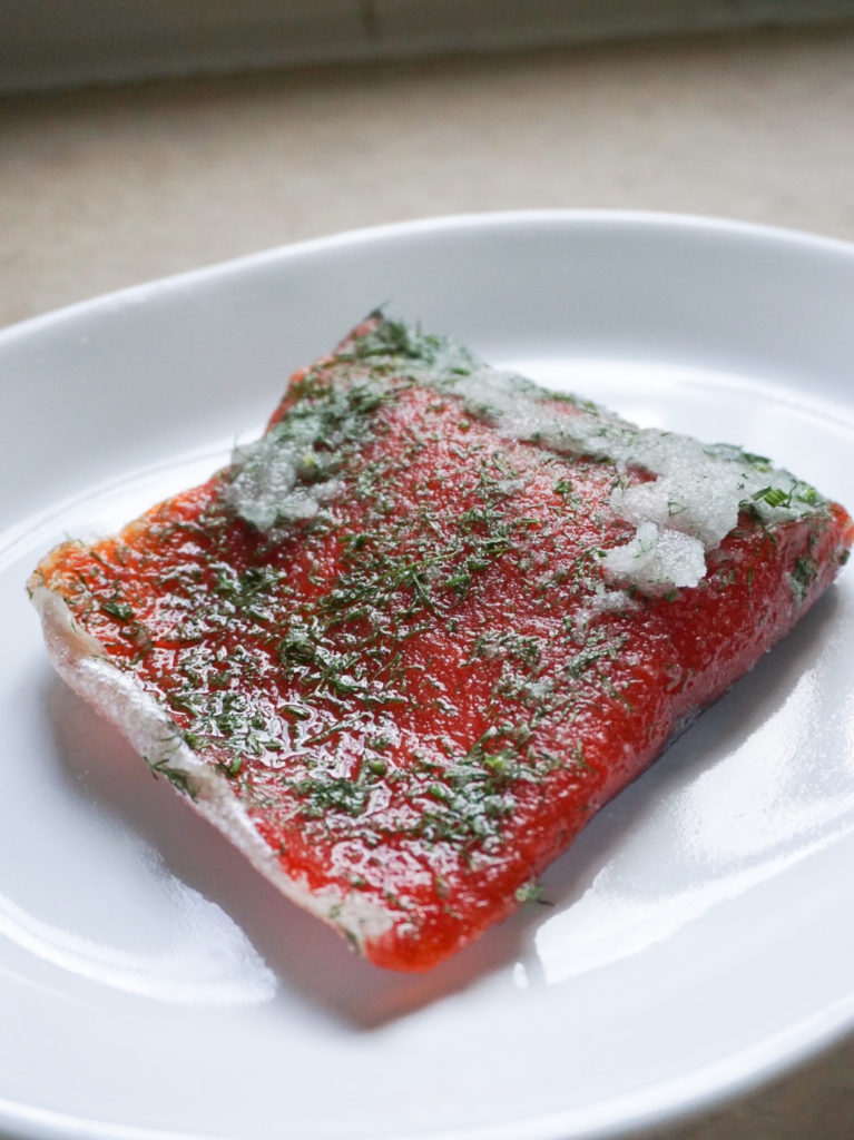 Salmon curing for gravlax salmon with dill-mustard dressing and homemade pickles