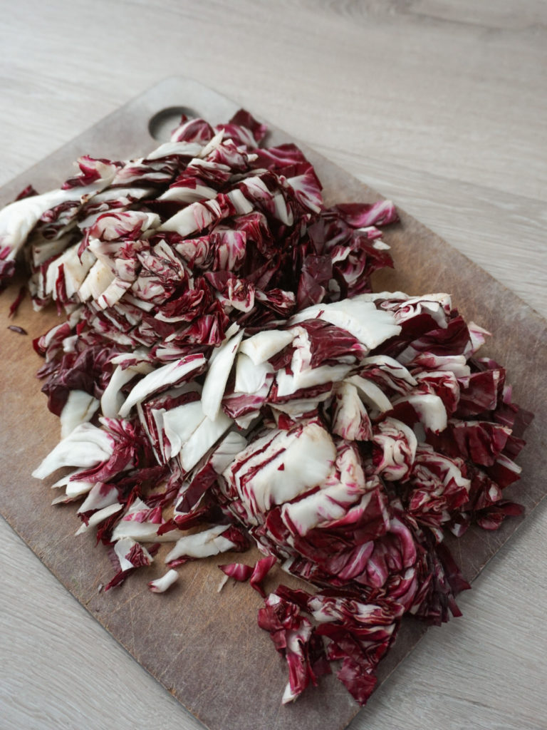 Chopped radicchio for farro salad with roasted root vegetables and pomegranate
