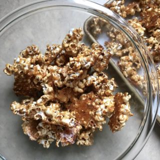 nutty spiced caramel corn in pyrex bowl