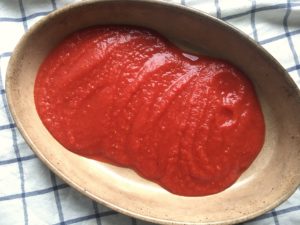 tomato puree in vintage gratin dish