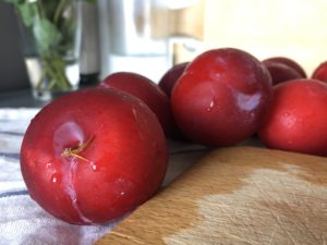 Washed plums on counter