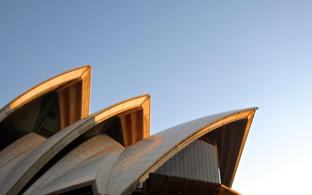 Three sails of the Sydney Opera House at golden hour
