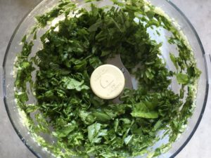 Basil and garlic in food processor to make pistou