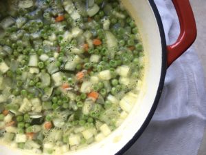 Soupe au pistou, or, French bean and pasta soup in red dutch oven