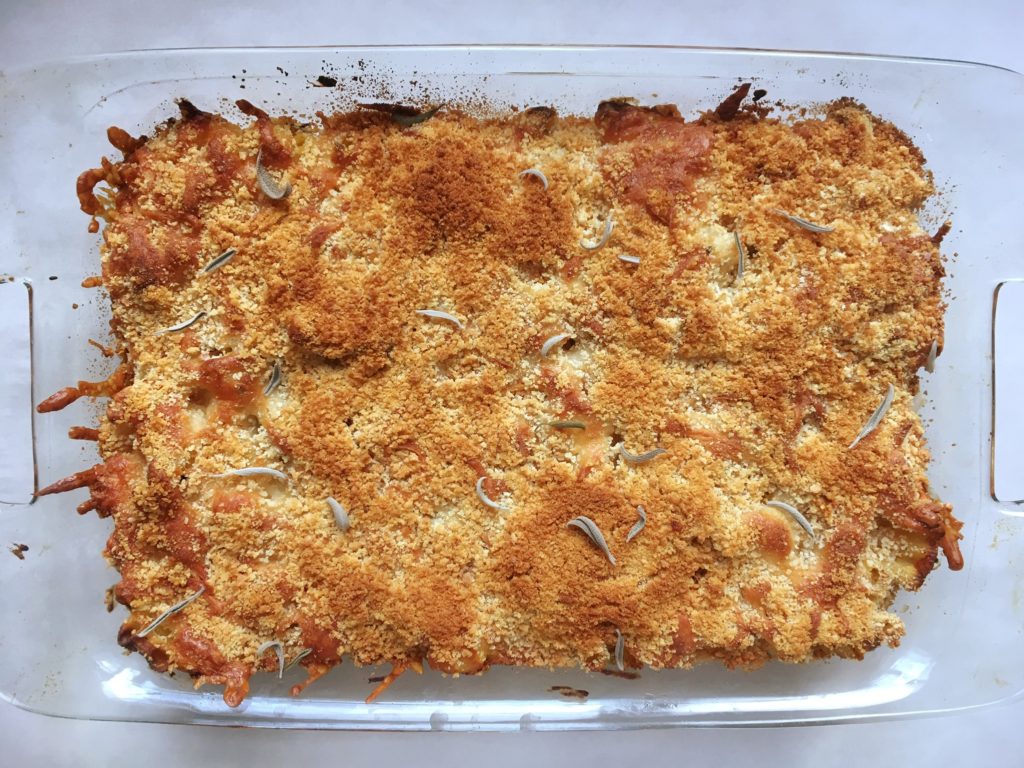 Healthier, lighter mac and cheese with butternut squash in a casserole dish