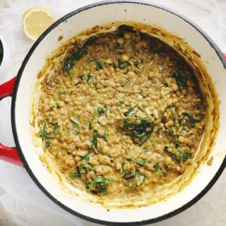 Yogurt soup with lentils, barley, and mint by Alice Hart, in red dutch oven with lemon and mint