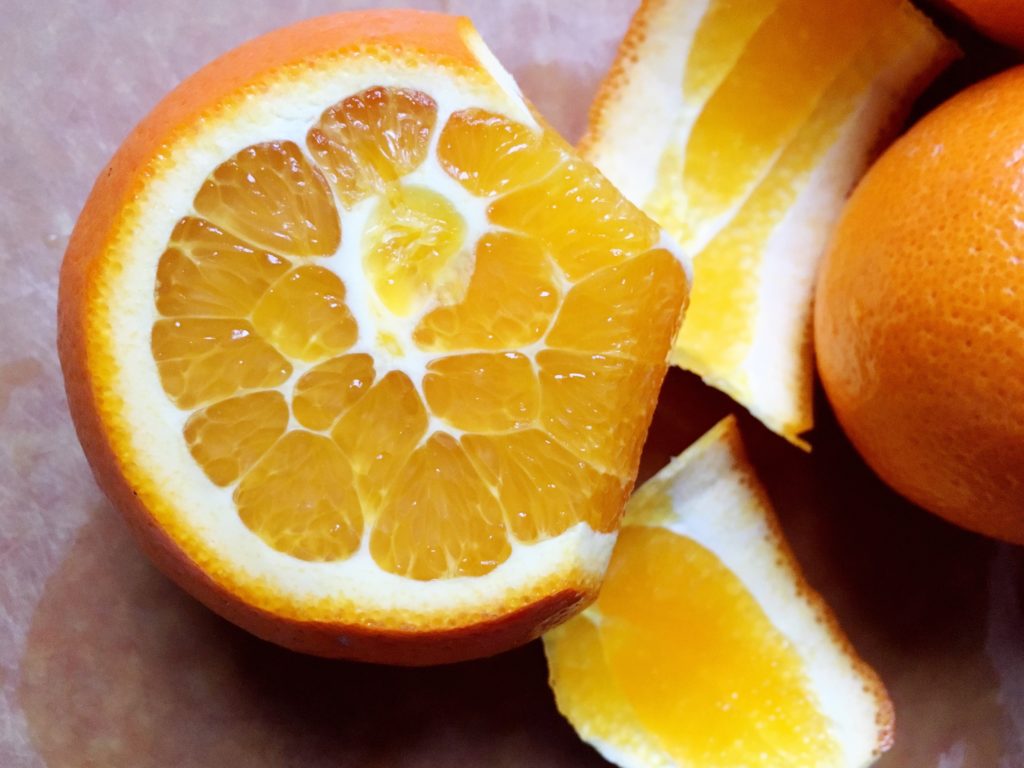 Cutting skin off orange