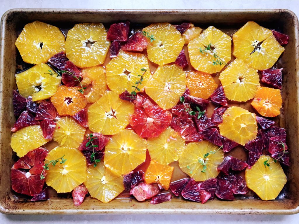 Roasted blood oranges, pre-roasting, with thyme in baking pan