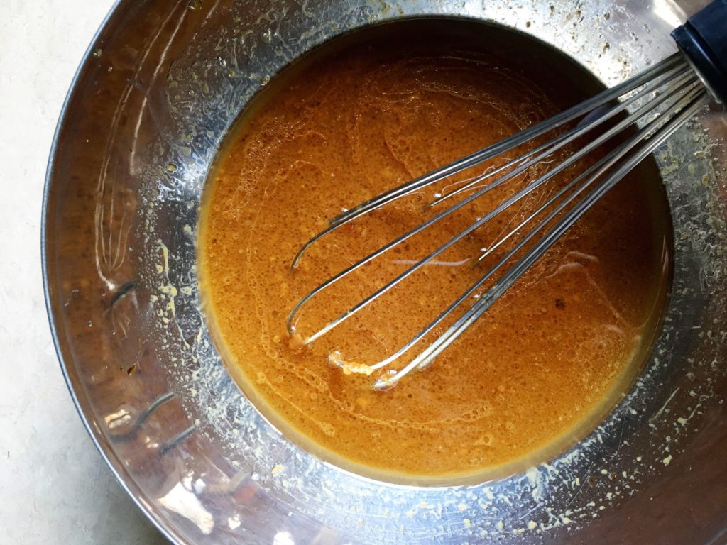 soy-ginger glaze in ikea bowl with whisk