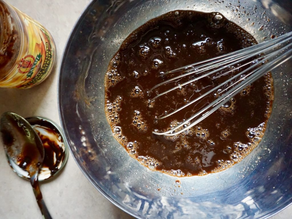 Homemade pad thai sauce with tamarind, fish sauce, and brown sugar in bowl