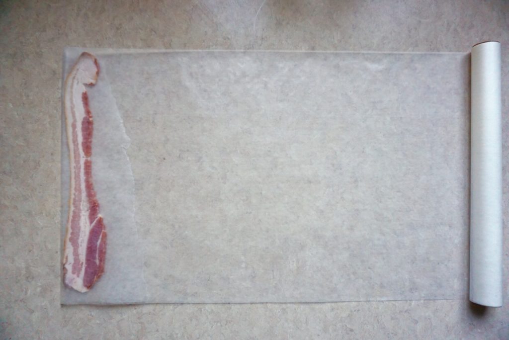 Slice of bacon on wax paper for best way to freeze bacon