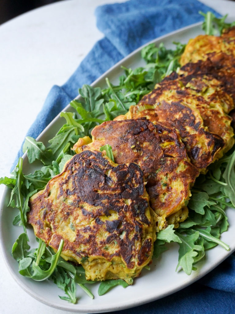 Leek fritters with herbed yogurt dollop from Ottolenghi's Plenty on arugula