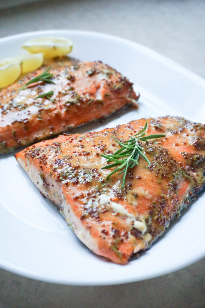 Cedar Grilled Salmon with Rosemary-Mustard Glaze on white plate