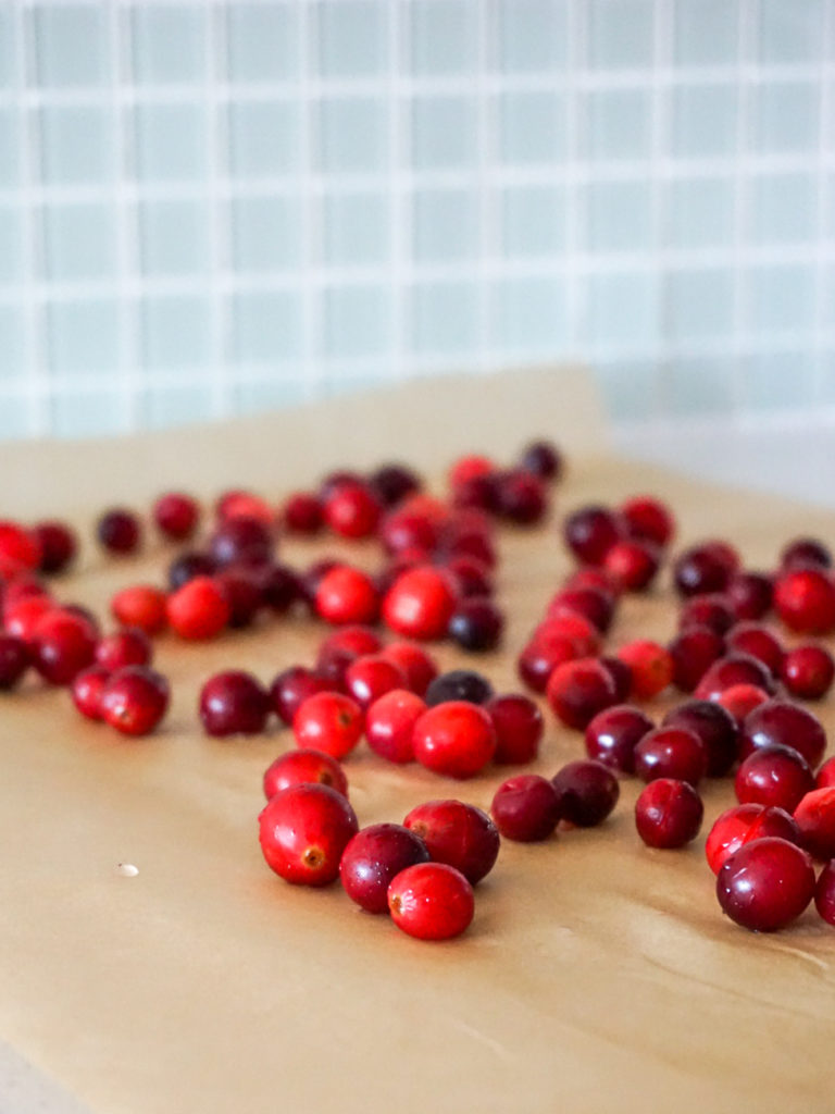 Cranberries drying on baking paper for Cranberry Lime Curd Pie from Bon Appetit