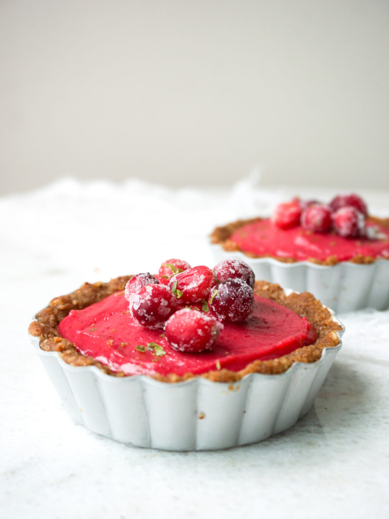 Two miniature cranberry-lime curd tarts