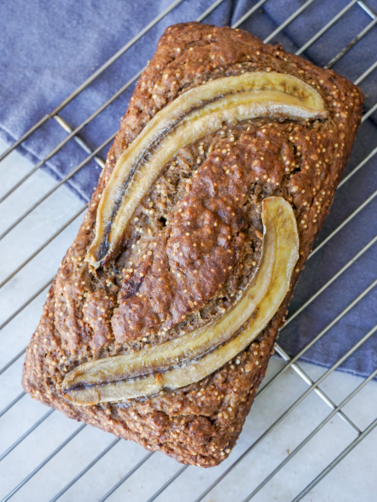 Whole banana bread loaf on cooling rack for easy healthy banana bread recipe