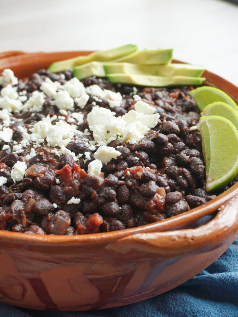 Overnight smoky black beans with feta, lime, and avocado