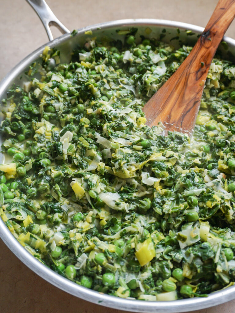 Spinach, peas, leeks, and goat cheese for polenta recipe